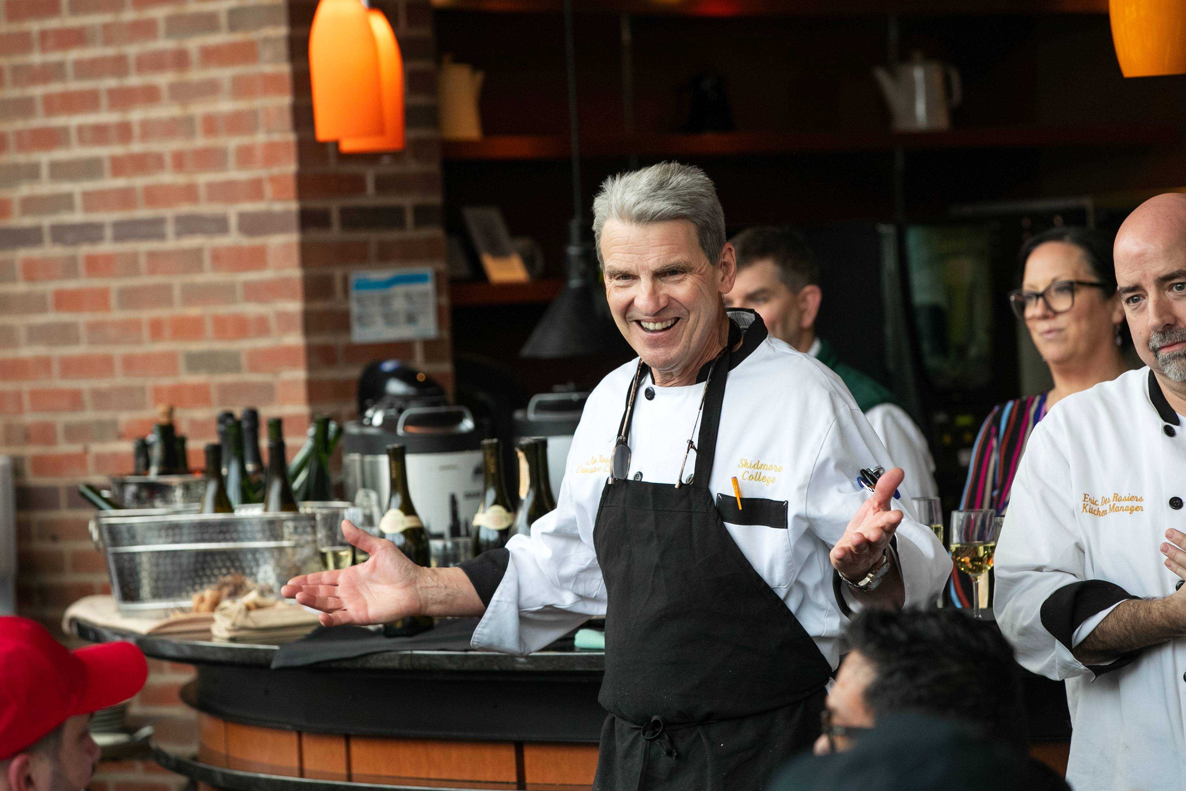 Executive Chef Jim Rose walks into the Atrium, smiling with his arms outstretched.