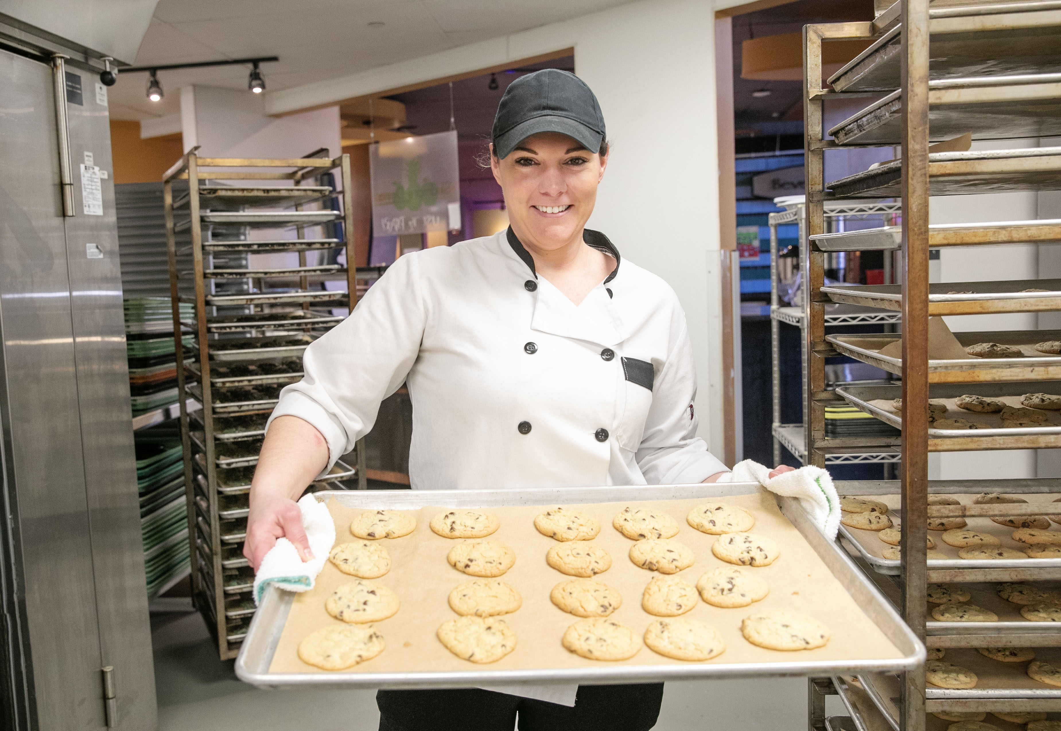 Shelly Carpenter holds up a tray of fresh cookies.