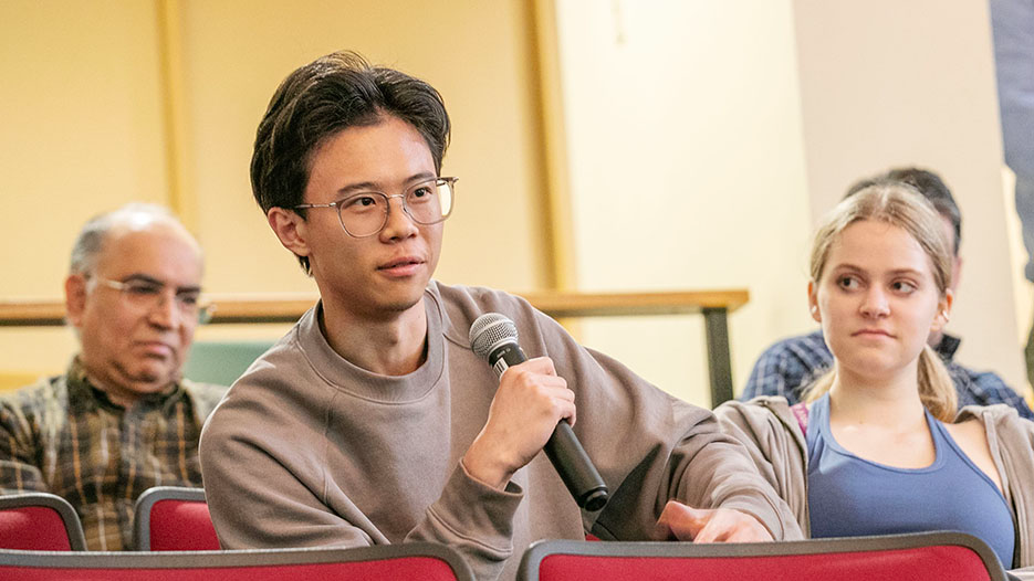  A student asks a question during Frederick M. Lawrence’s public talk. 