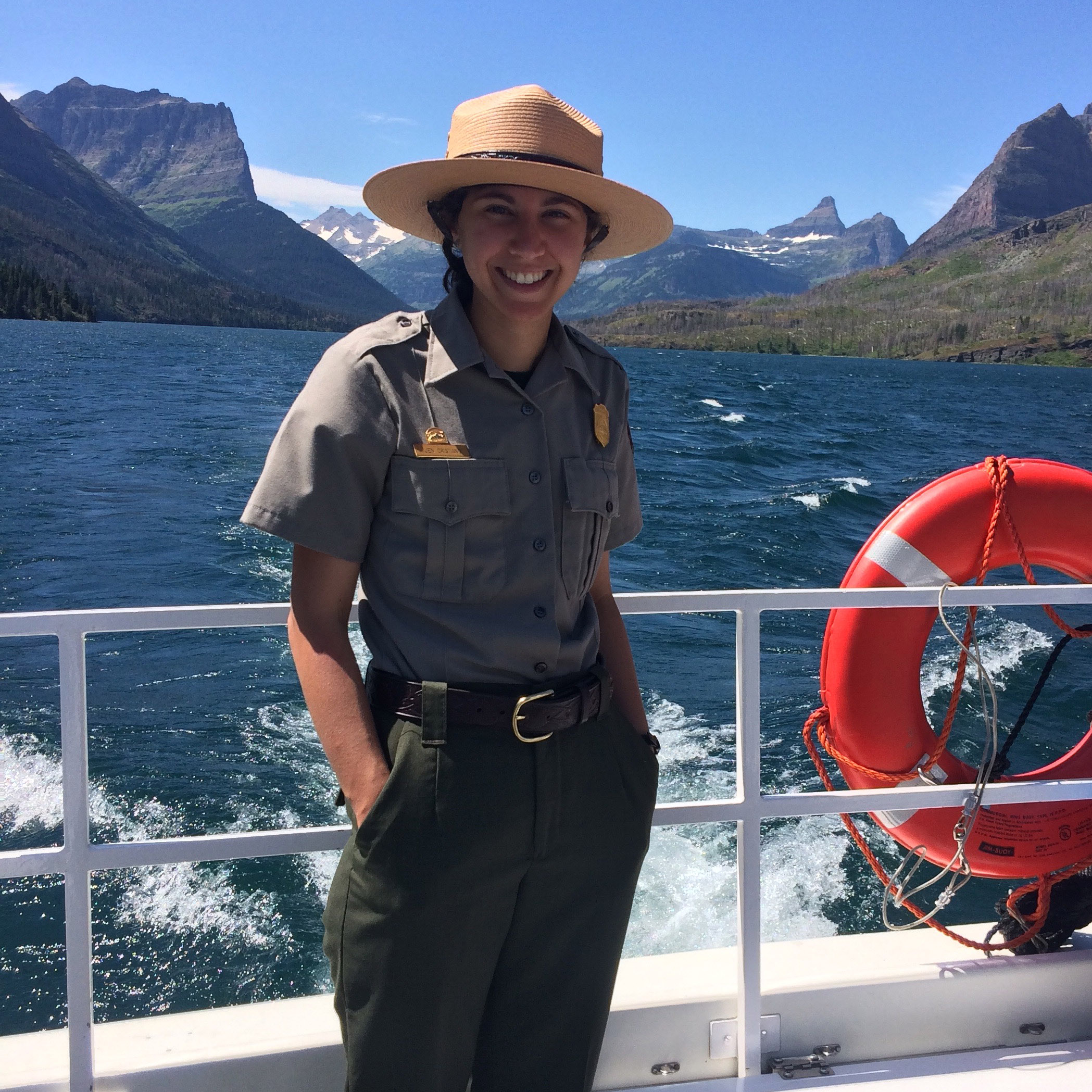 Jennifer+Cristiano+%E2%80%9918+stands+on+the+deck+of+a+boat+in+her+uniform.+A+range+of+mountains+can+be+seen+from+across+the+water.