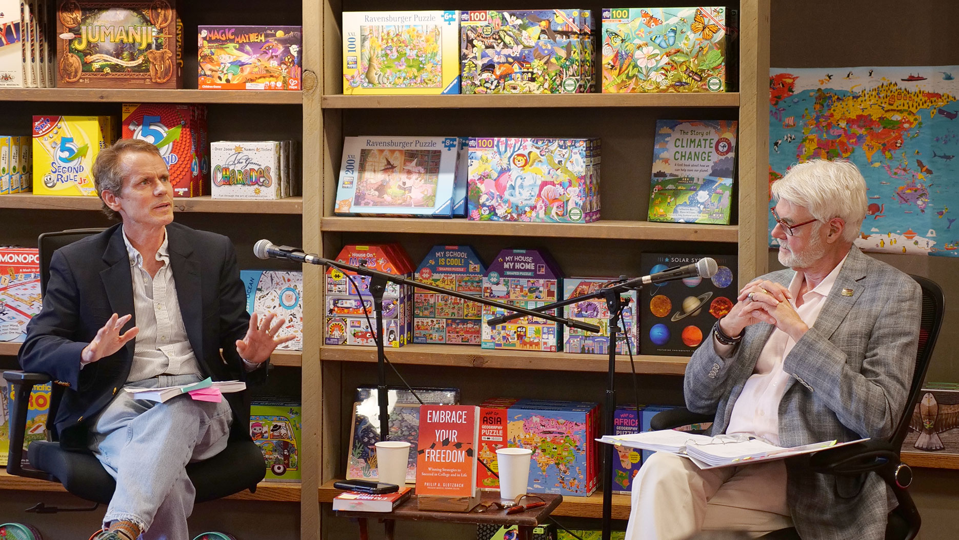 President Emeritus Philip A. Glotzbach, right, discusses his new book, “Embrace Your Freedom: Winning Strategies to Succeed in College and in Life” with Joseph C. Palamountain Jr. Chair in Government Beau Breslin during a July 9 event at Northshire Bookstore in Saratoga Springs. 