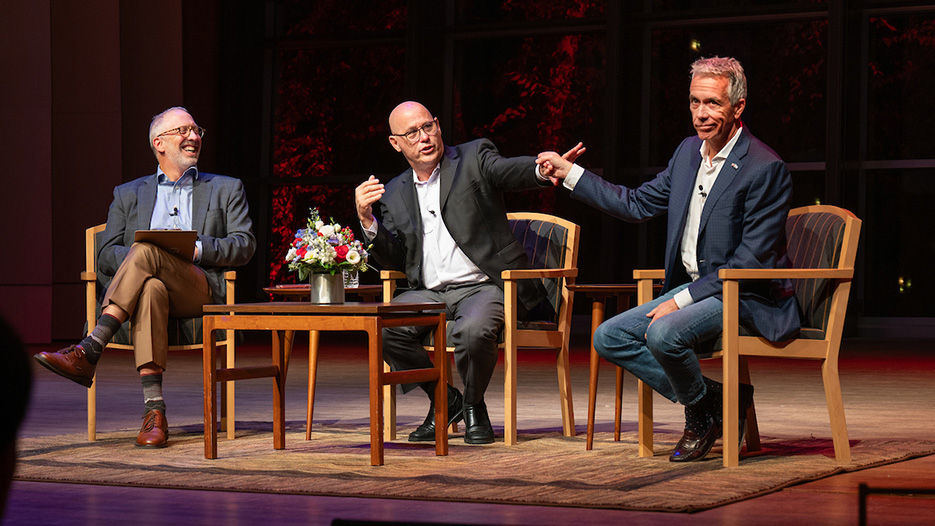 Skidmore alumnus Fred Guttenberg ’88 (center), whose daughter was murdered in the 2018 Parkland school shooting, and former Republican U.S. Rep. Joe Walsh (right) exchange views during "Two Dads Defending Democracy: Bridging the Gap During Divisive Times” at Arthur Zankel Music Center. Professor of Sociology John Brueggemann (left) moderated the conversation.
