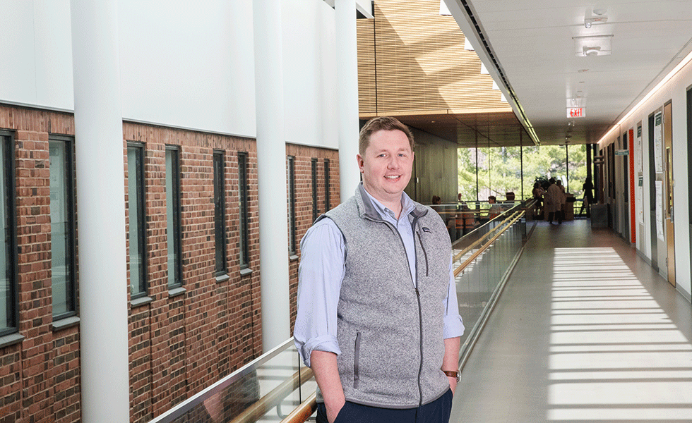 Matt Walsh '13 poses on second level balcony of Skidmore's Billie Tisch Center for Integrated Sciences