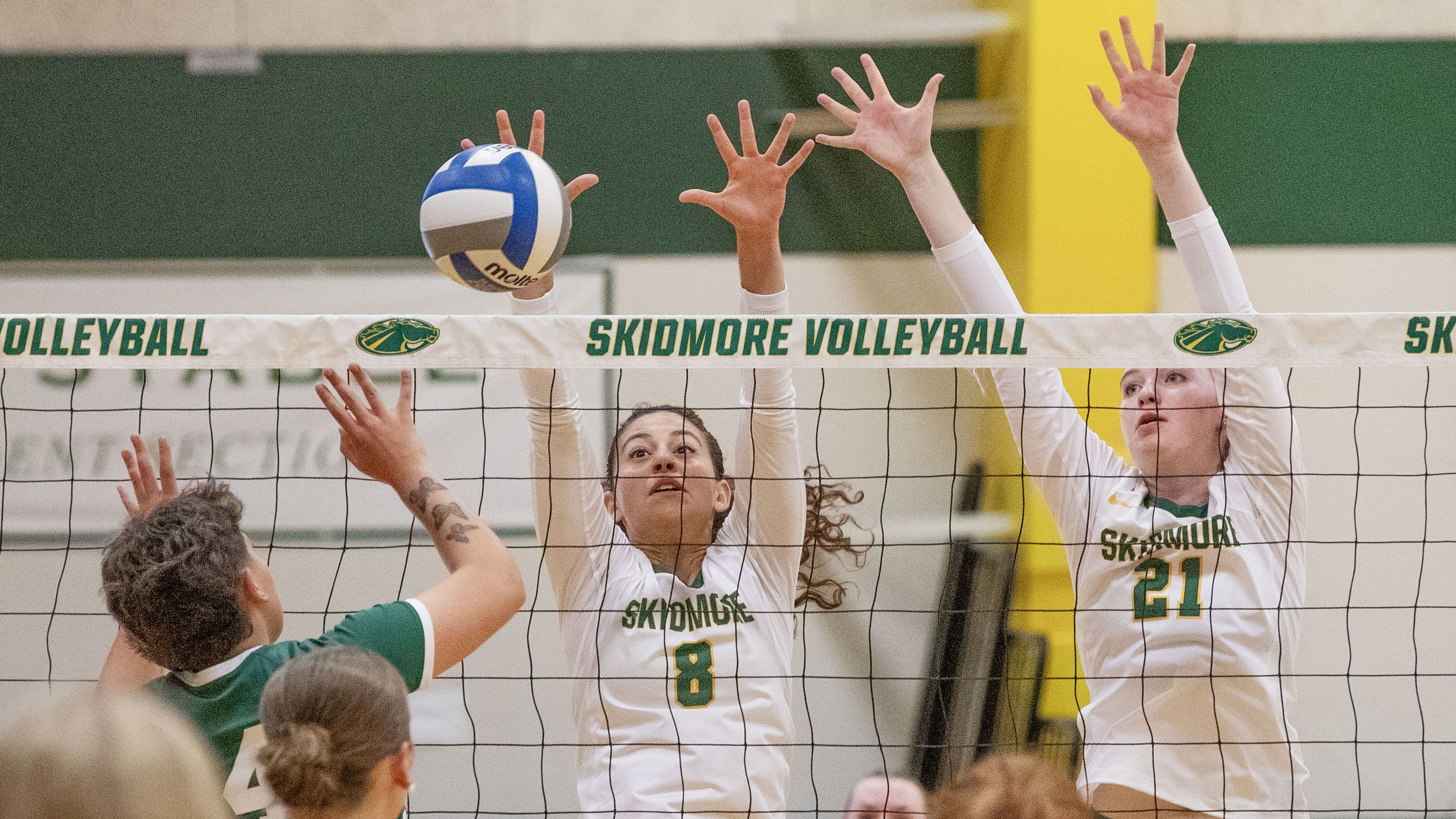 Skidmore volleyball players Gabriella Imburgia '27 and Katy O'Connell '29 block the ball against Nichols College on Friday, Sept. 5. 