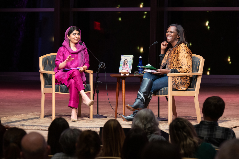 Malala Yousafzai in conversation with ABC News' Deborah Roberts on stage in Skidmore's Arthur Zankel Music Center