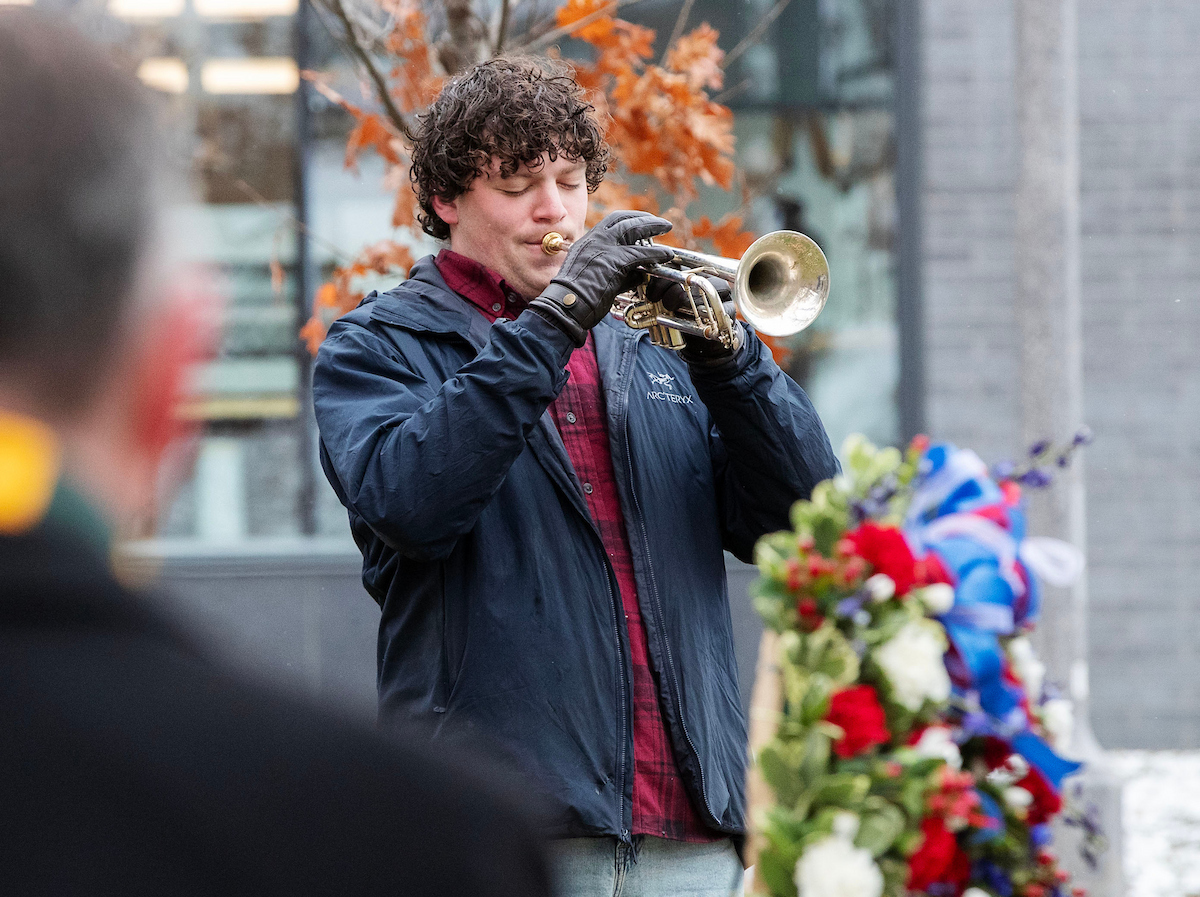Linden Amster ’27 playing taps during the ceremony