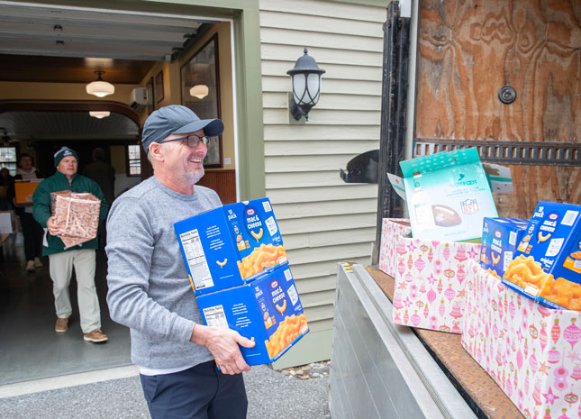 Skidmore employee Thomas Marcullus lends a hand during Skidmore Cares at the Scribner Carriage House in 2025.