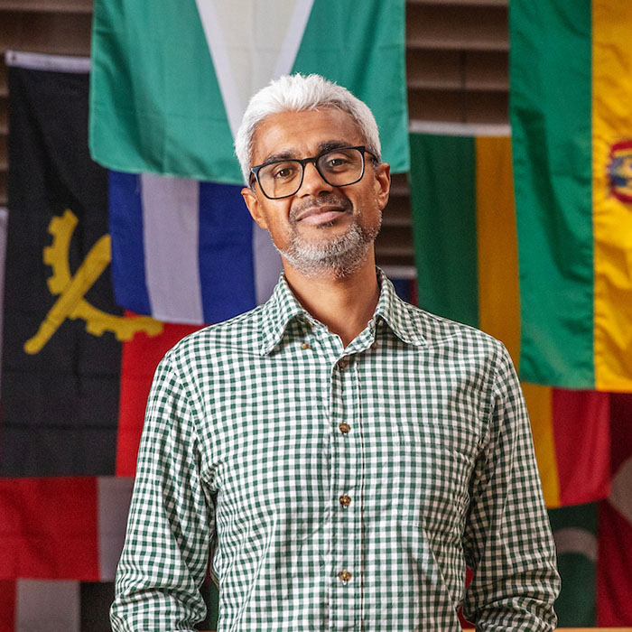 Mahesh+Shankar+in+front+of+flags+in+Skidmore%27s+Case+Center+