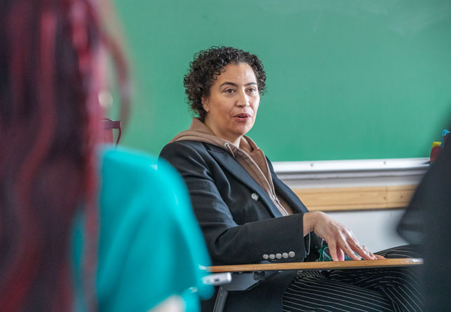 Meredith Broussard speaks with students during a classroom discussion on campus.