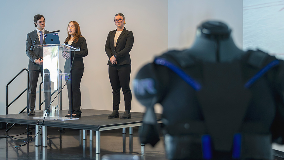 From left, Justin Shafritz ’26, Liala Cryer ’26, and Molly Smith ’27 explain their business plan for Polar Athletics to alumni judges before winning the first-place, $20,000 prize in the 2026 Kenneth A. Freirich Entrepreneurship Competition.