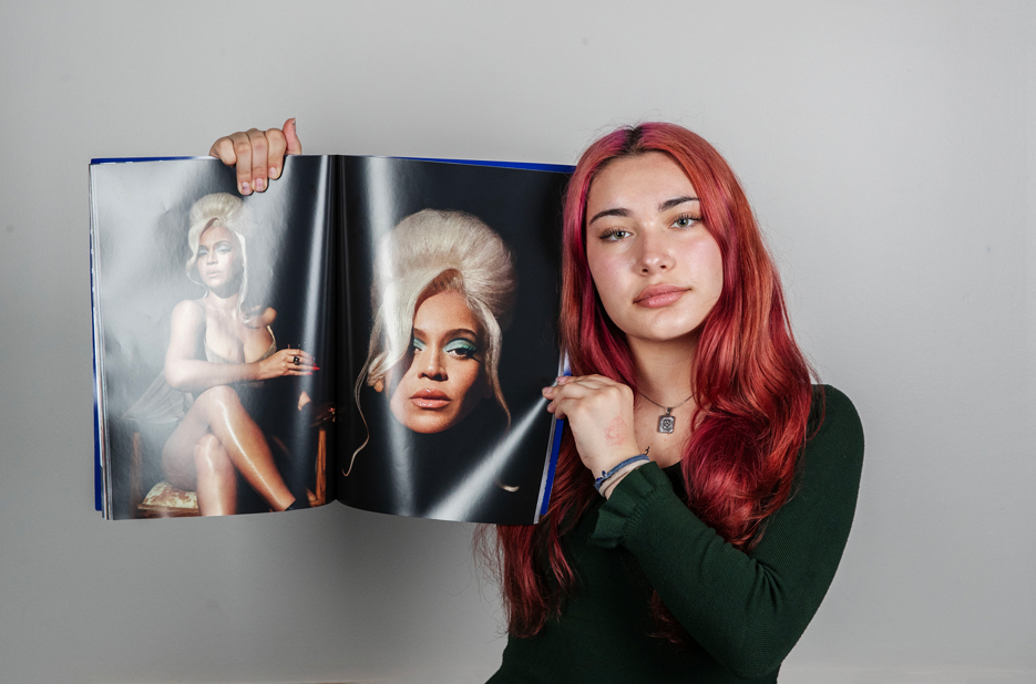 Giulia Chiodi ’29 poses with images of Beyoncé
