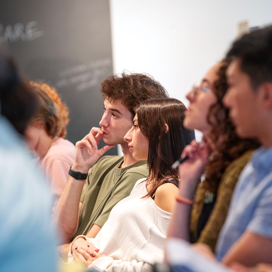 Students+listen+intently+during+an+election+program+at+the+Tang+Teaching+Museum