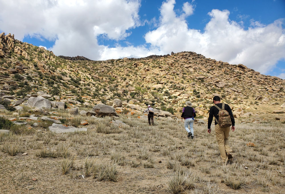 Eben Drake ’27 walks with colleagues on the Mongolian steppe