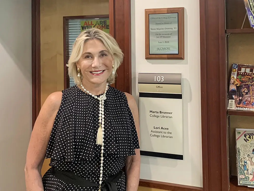 Susan Magrino '83 in front of the Scribner Library librarian's office. 