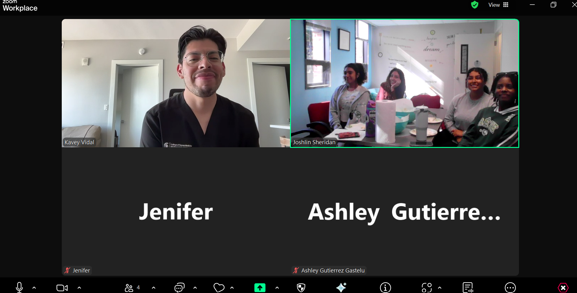 A Zoom meeting shows an alumnus speaking from home while several Skidmore College students listen and smile together in a campus room.