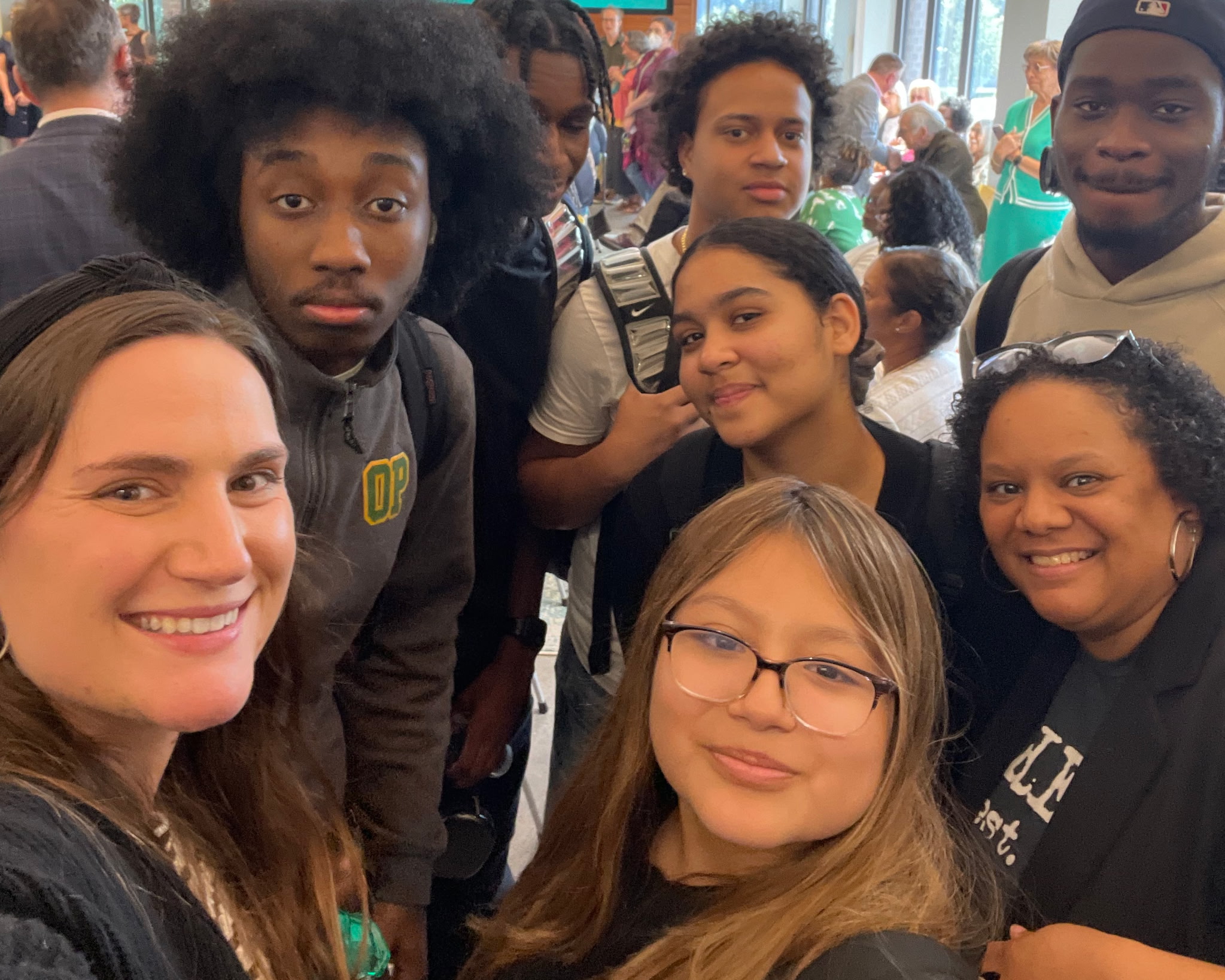 Students and staff of the HEOP program gather for a photo at an event.