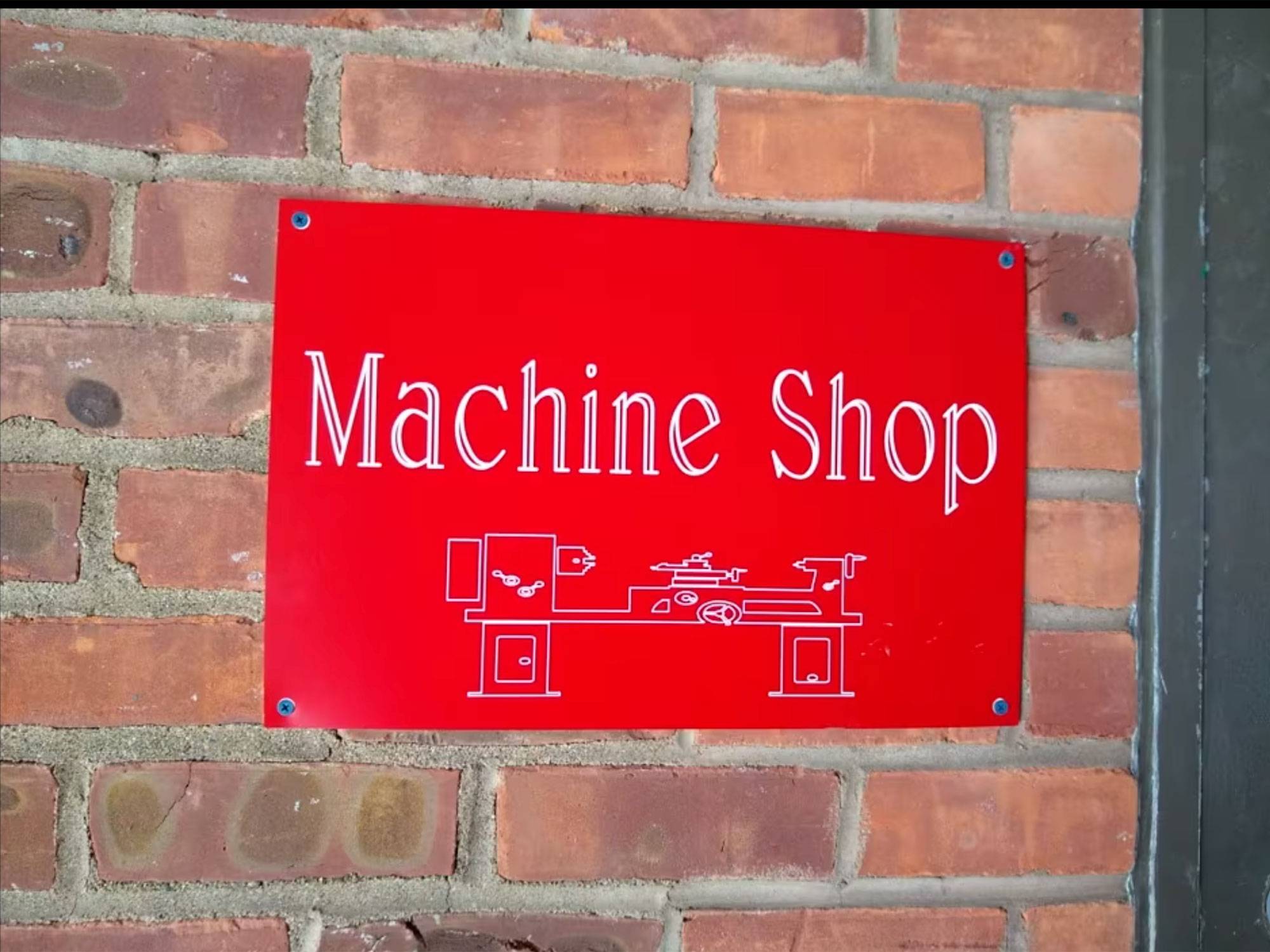 Photo of Machine Shop sign outside of the shop