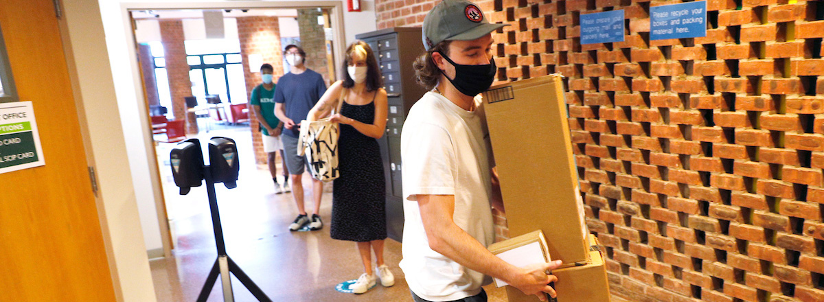 Student collecting package at Skidmore Post Office