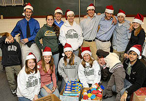  Skidmore student athletes and local children with donated food 