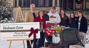 President Glotzbach and Marie Glotzbach with student volunteers for Skidmore Cares, along with some of the donations received.