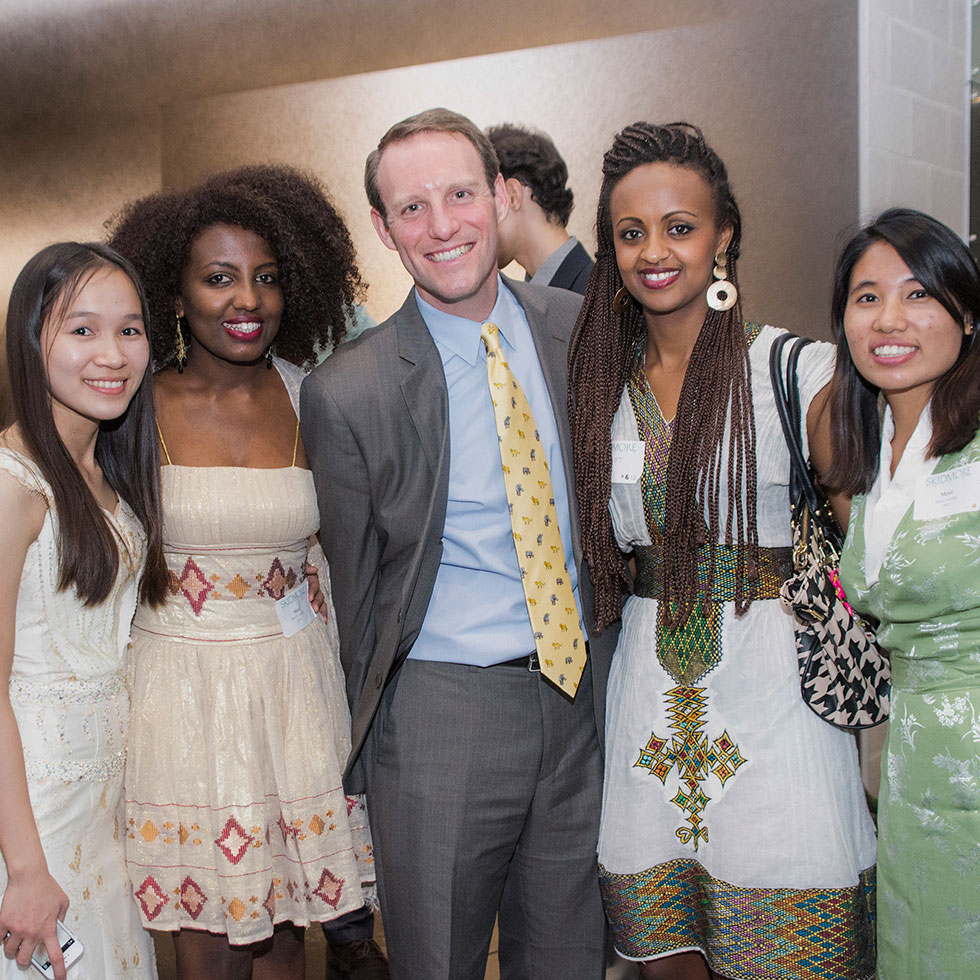 Four students pose with Darren Drabek of Admissions, all in formal attire