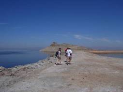 Kim Marsella, Bob Turner and Michael Ennis-McMillan walking along the shore of the Salton Sea